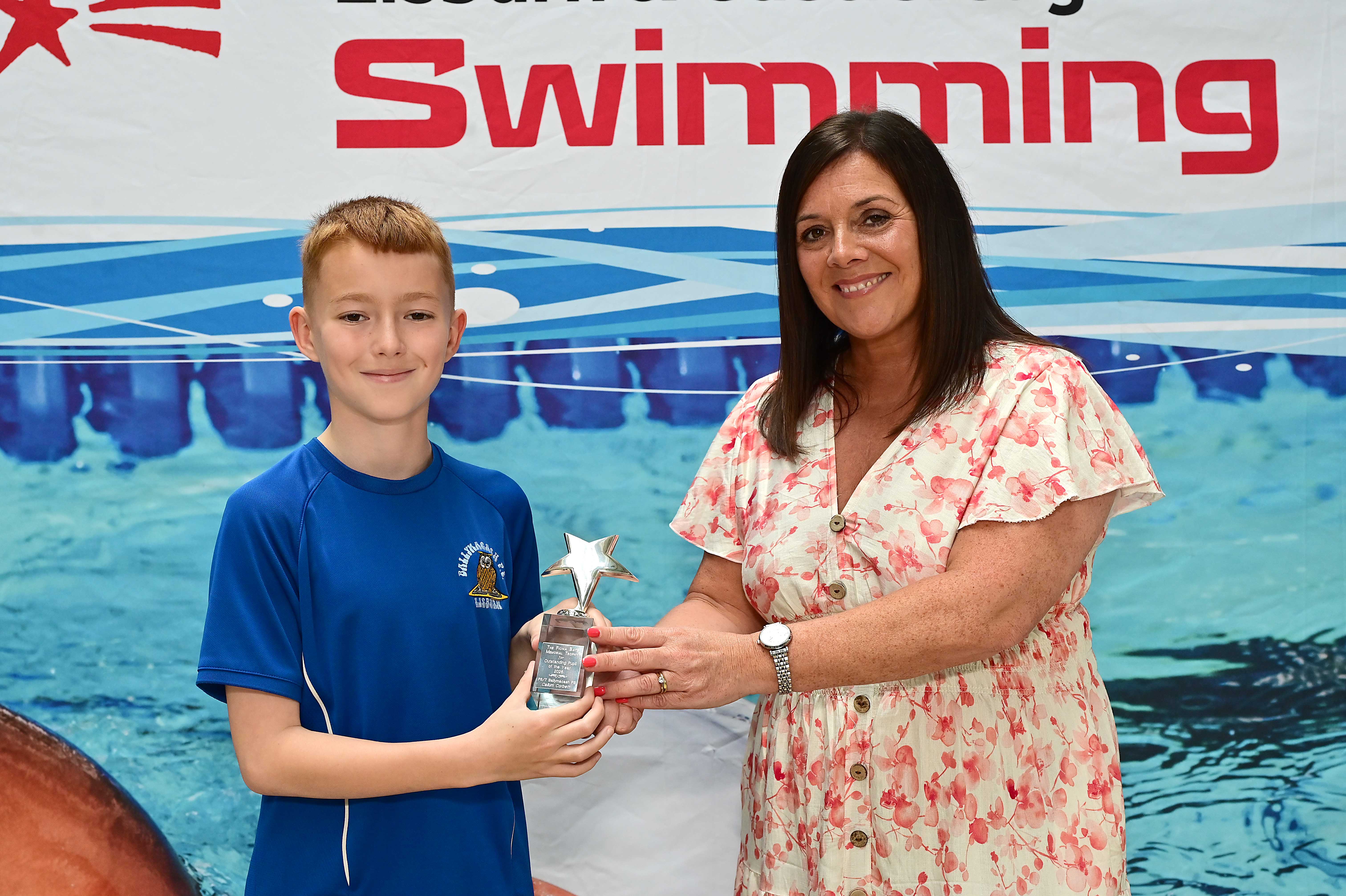 Callum Corbett (Ballymacash Primary School), winner of the Fiona Bates Memorial Special Achievement Award pictured with Chair of Communities and Wellbeing Committee, Councillor Sharon Lowry 