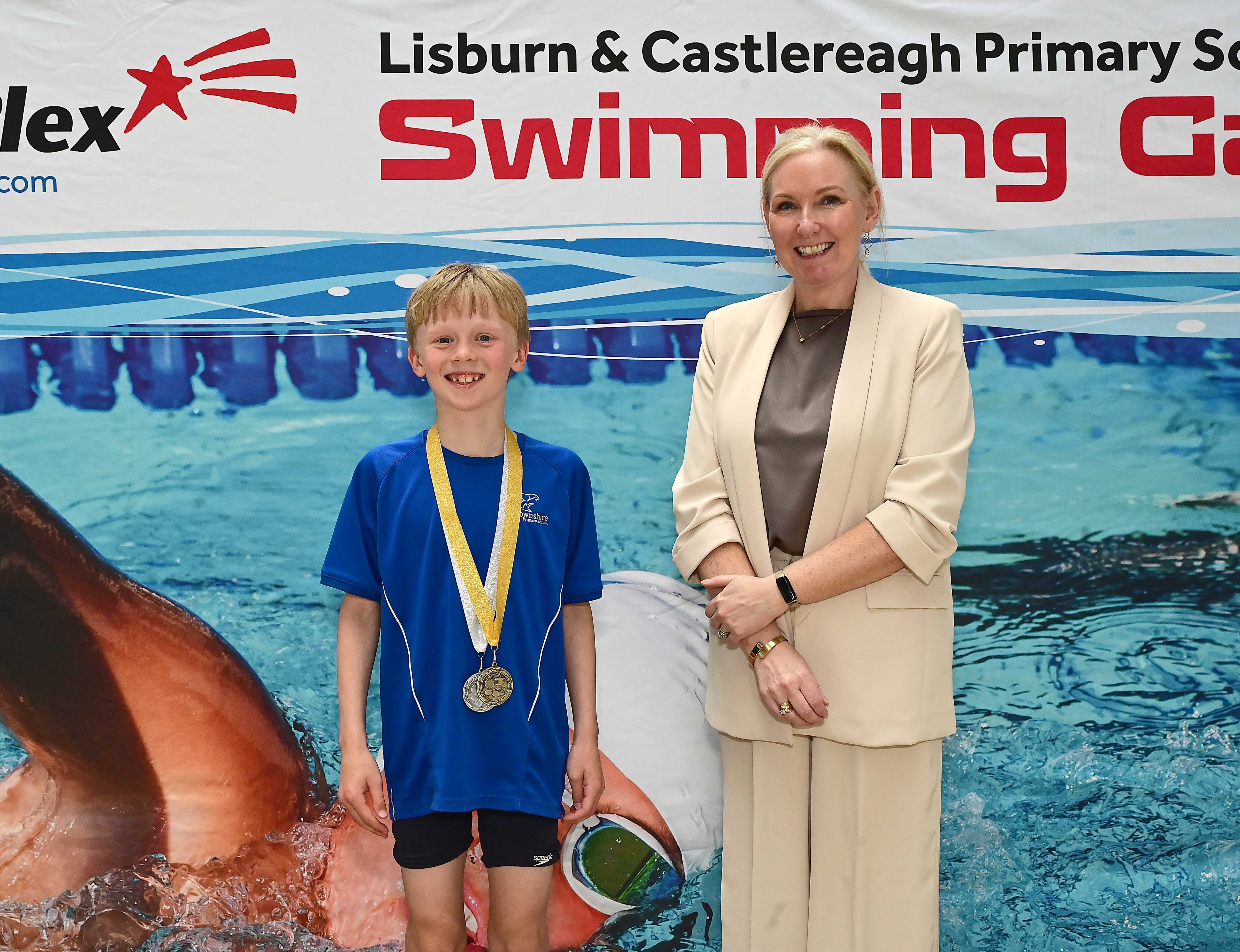 Louise Moore, Director of Leisure & Community Wellbeing presents Event 13 Butterfly to Club winner Tom McGonigle (Downshire) in 1st place.  