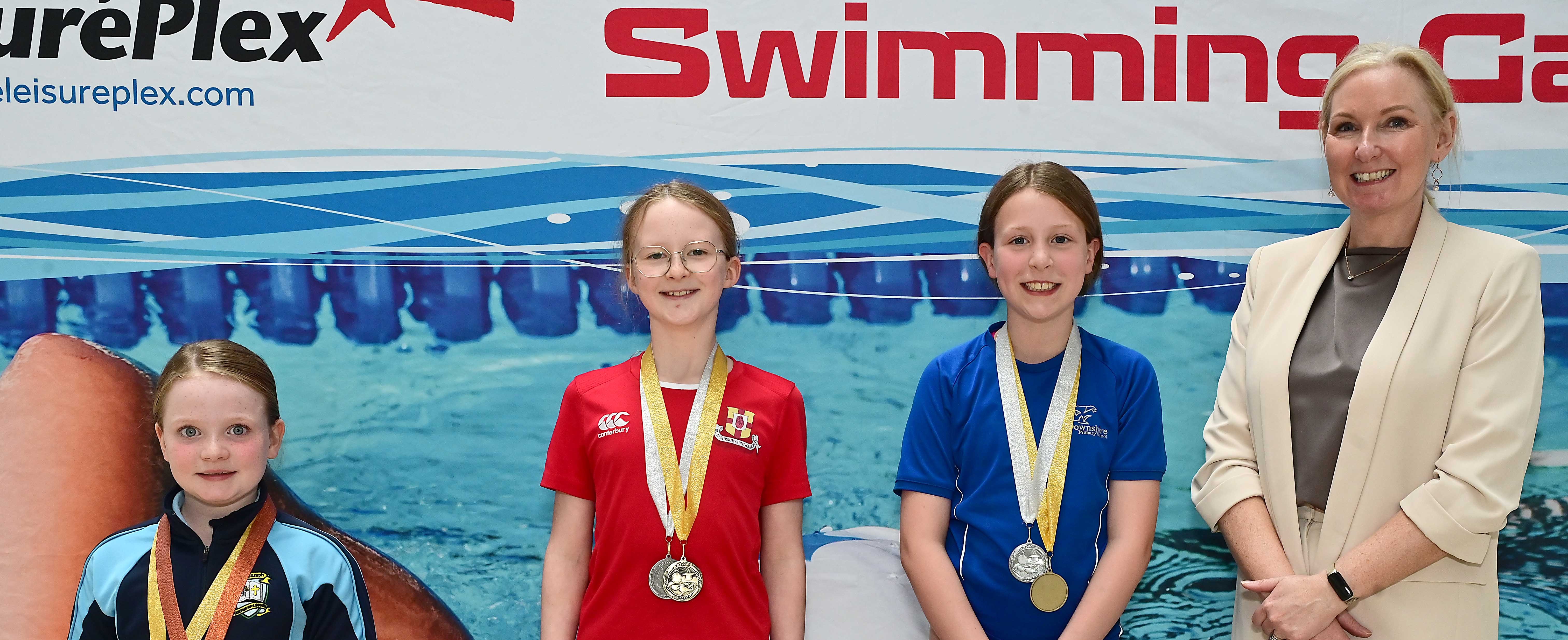 Louise Moore, Director of Leisure & Community Wellbeing presents Event 14 Butterfly (Club) to 1st Freya Snoddy (Friends’ Prep), 2nd Alannah Hamilton (Downshire) and 3rd Camille Bowman (St Joseph’s)  