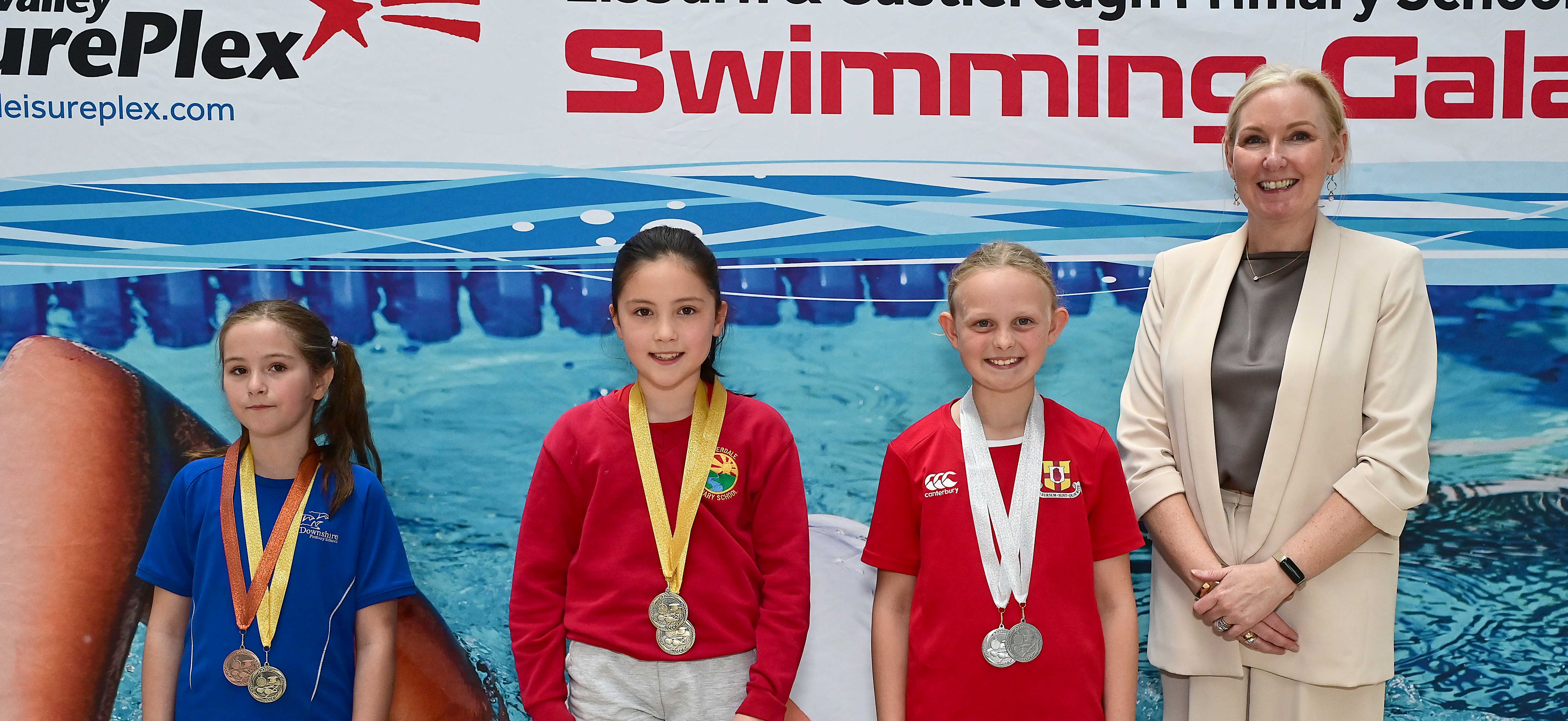 Louise Moore, Director of Leisure & Community Wellbeing presents Event 14 Butterfly (non-club) to 1st Odelia Arbuthnot (Riverdale), 2nd Anna Bell (Friends’ Prep) and 3rd Charlotte Watkins (Downshire) 