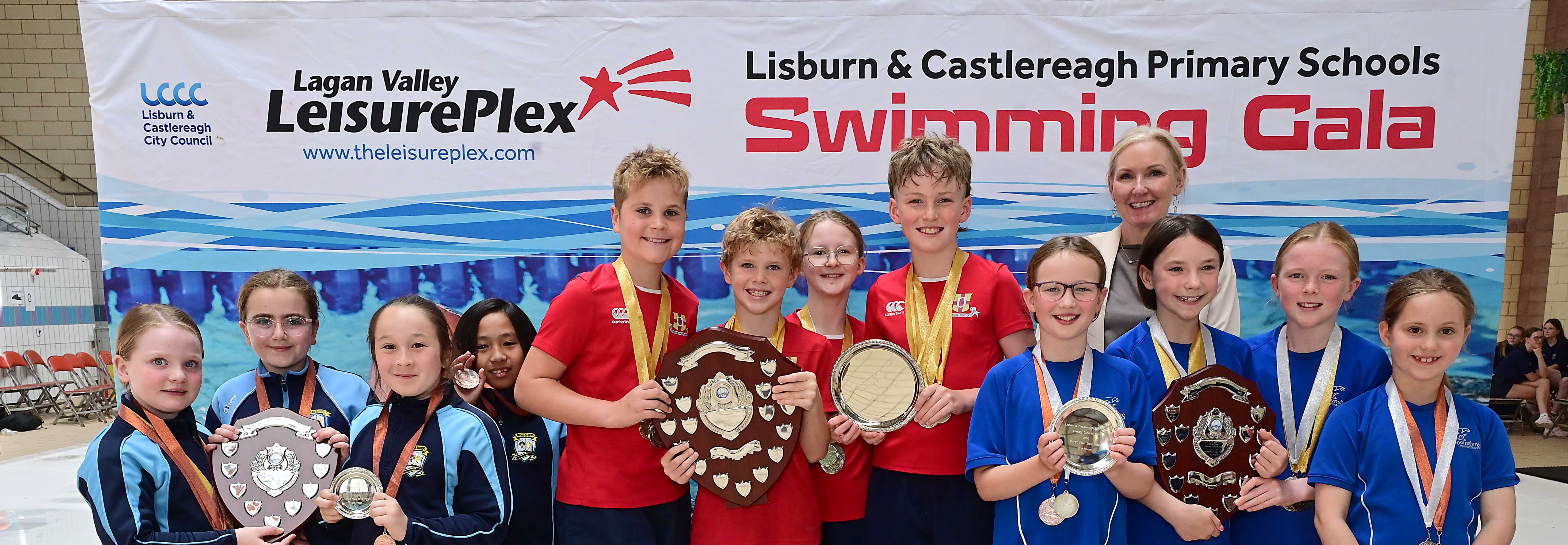 Louise Moore, Director of Leisure & Community Wellbeing presents Event 15 Freestyle Relay to Friends’ Prep in 1st place, Downshire Primary School in 2nd place and St Joseph’s Primary School in 3rd place.  