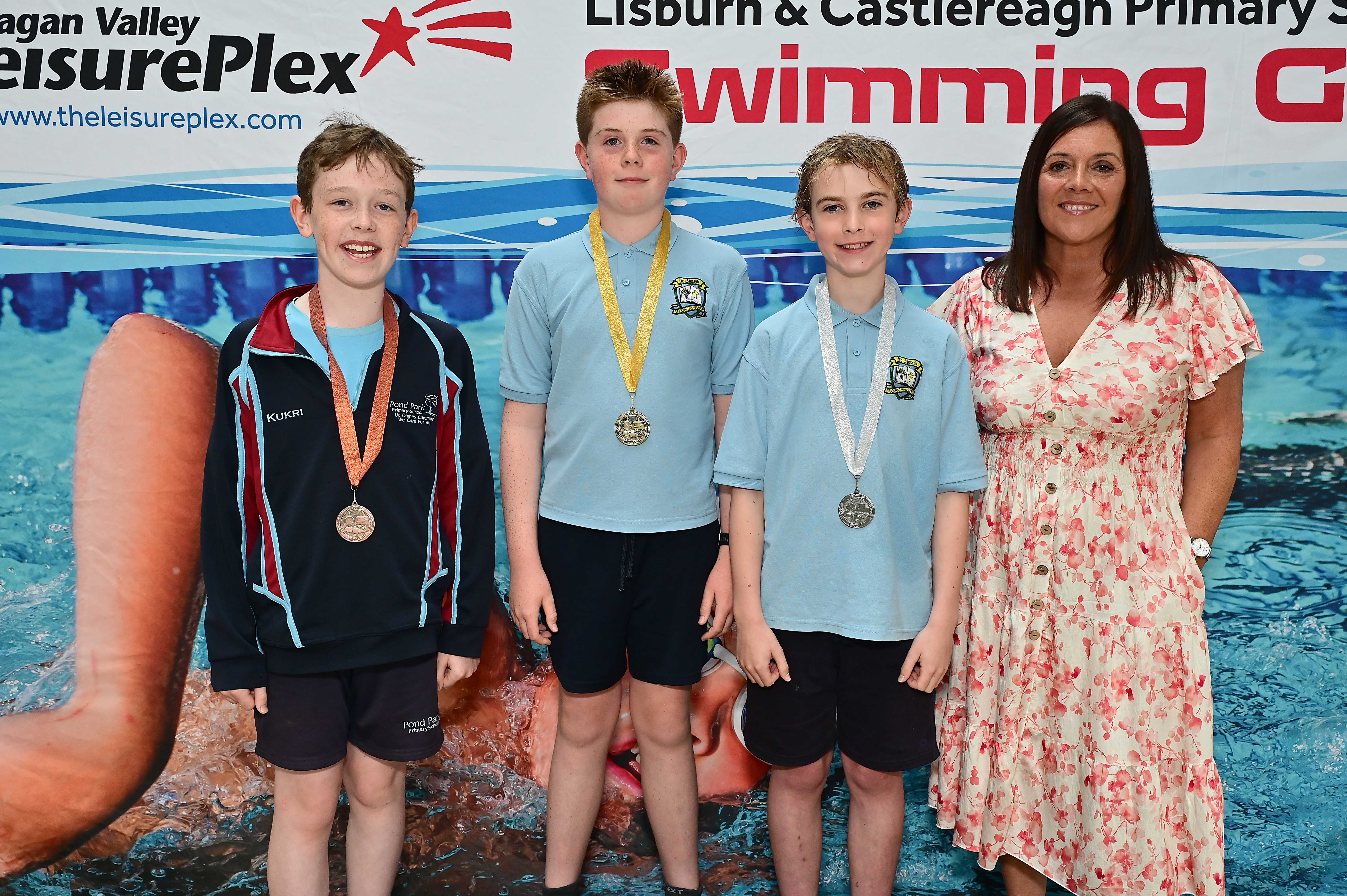 Chair of Communities and Wellbeing Committee, Councillor Sharon Lowry presents Event 18 Backstroke (Club): 1st Eunan McCrudden (St Joseph’s), 2nd Cillian O’Neill (St Joseph’s) and 3rd Gideon Mercer (Pond Park)  