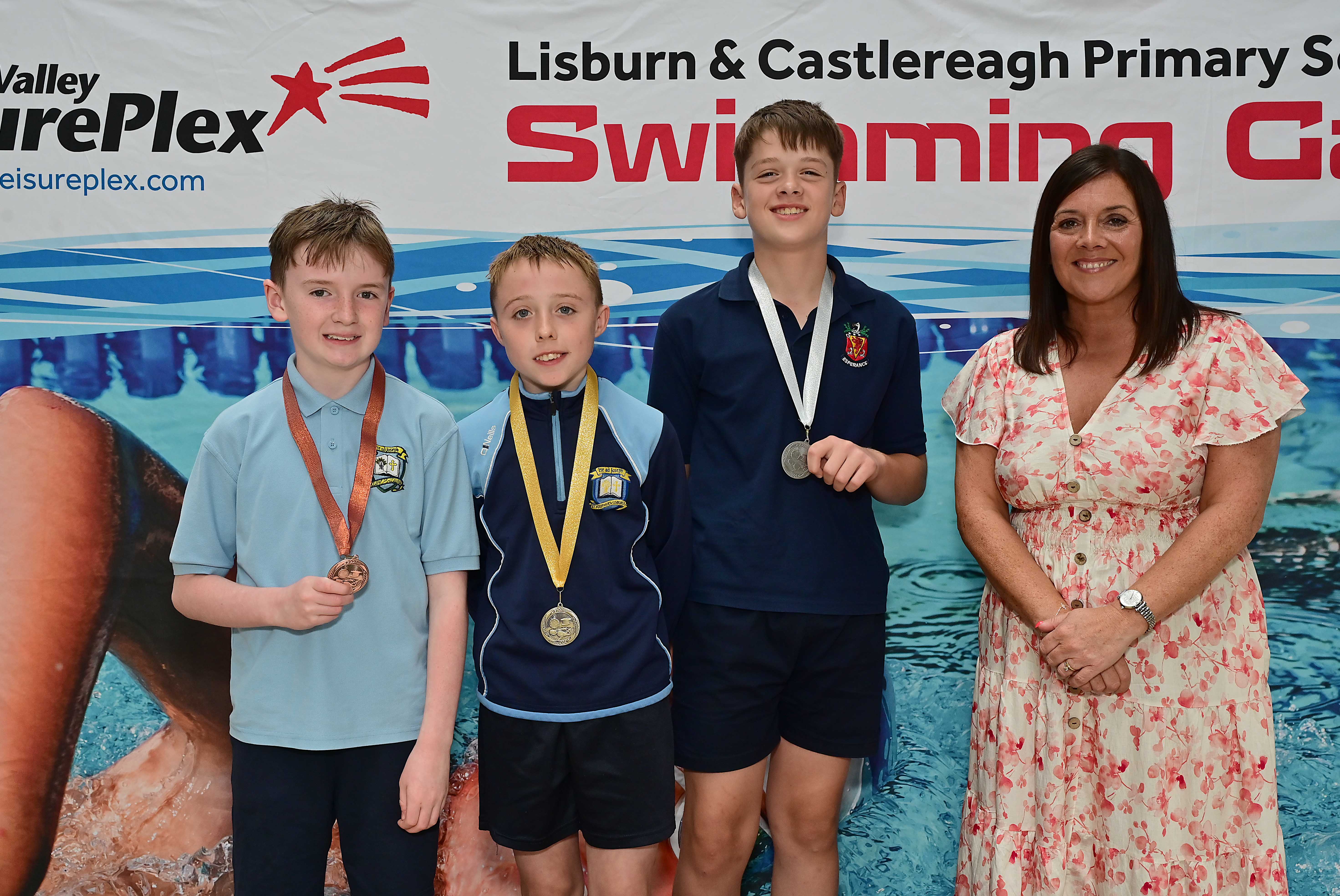 Chair of Communities and Wellbeing Committee, Councillor Sharon Lowry presents Event 18 Backstroke (Non-club): 1st Tommy McKee (St Joseph’s), 2nd James Armstrong (Wallace Prep) and 3rd  Arlo Hanley (St Joseph’s) 
