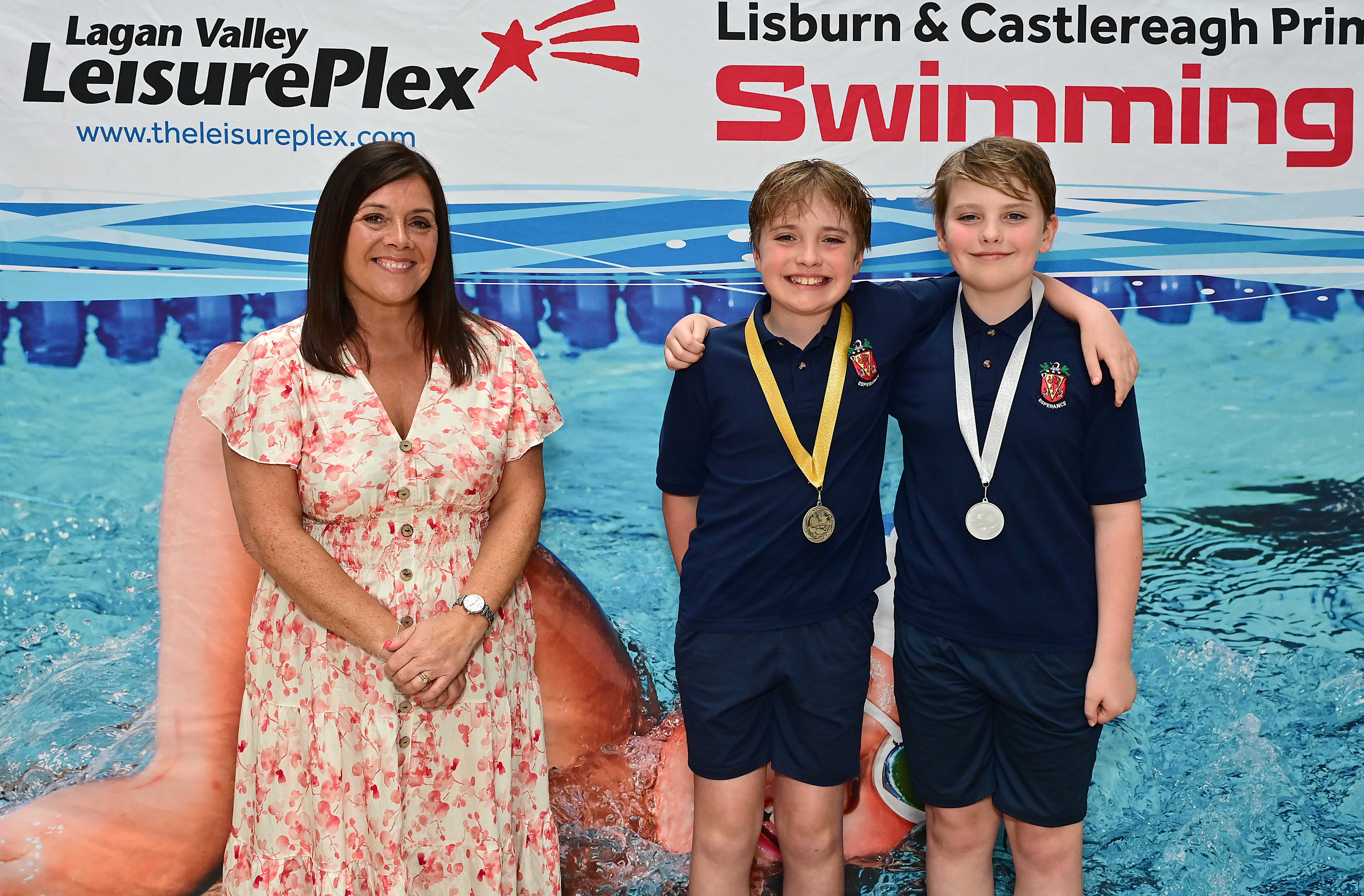 Chair of Communities and Wellbeing Committee, Councillor Sharon Lowry presents Event 20 Breaststroke (Club): 1st Teddy Burke (Wallace Prep) and 2nd Elliott Burke (Wallace Prep)  