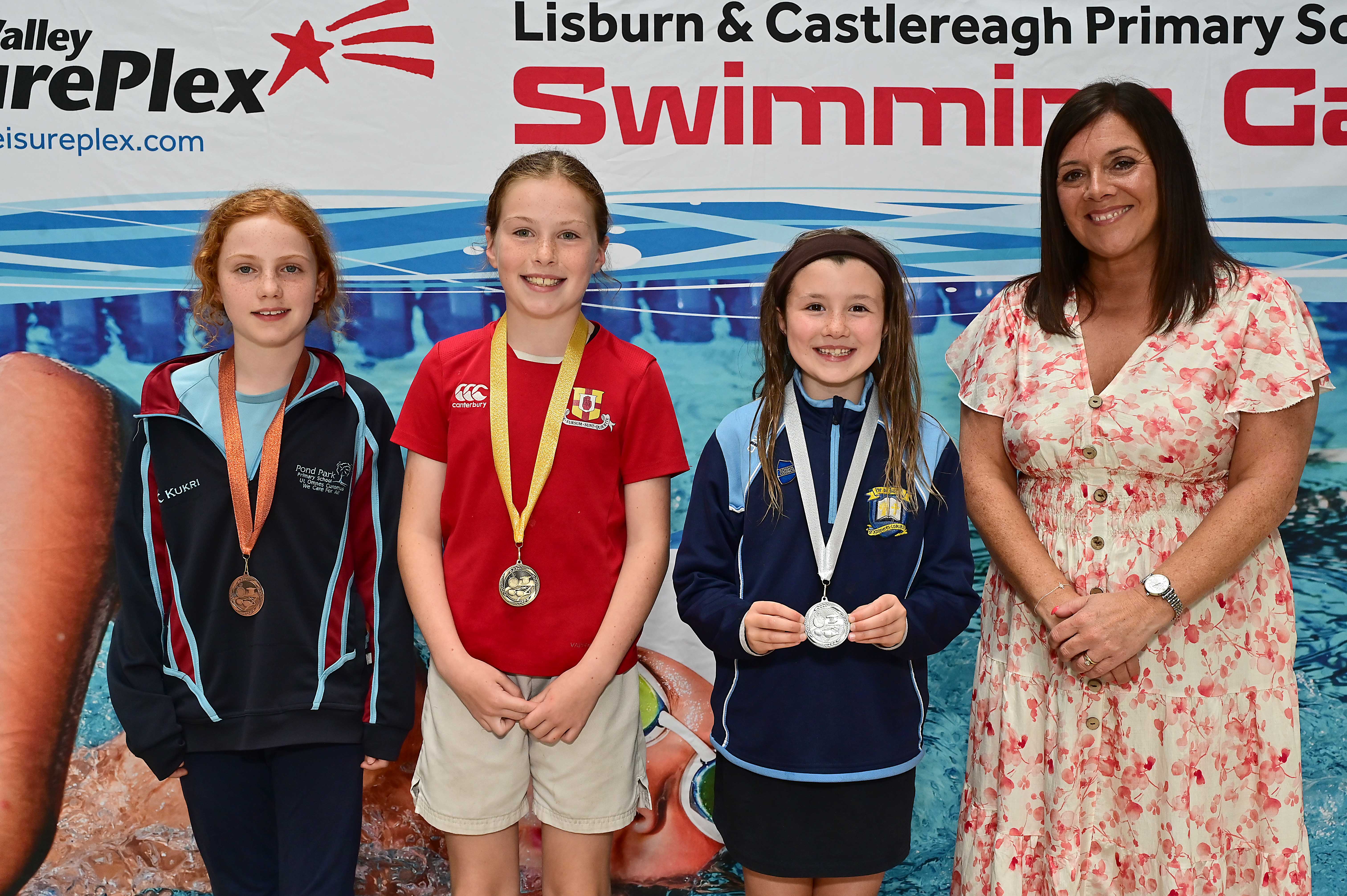 Chair of Communities and Wellbeing Committee, Councillor Sharon Lowry presents Event 21 Breaststroke (Non-club): 1st Holly Storey (Friends’ Prep)    2nd Erin Hutchinson (St Joseph’s) and 3rd  Martha Morrison (Pond Park)  