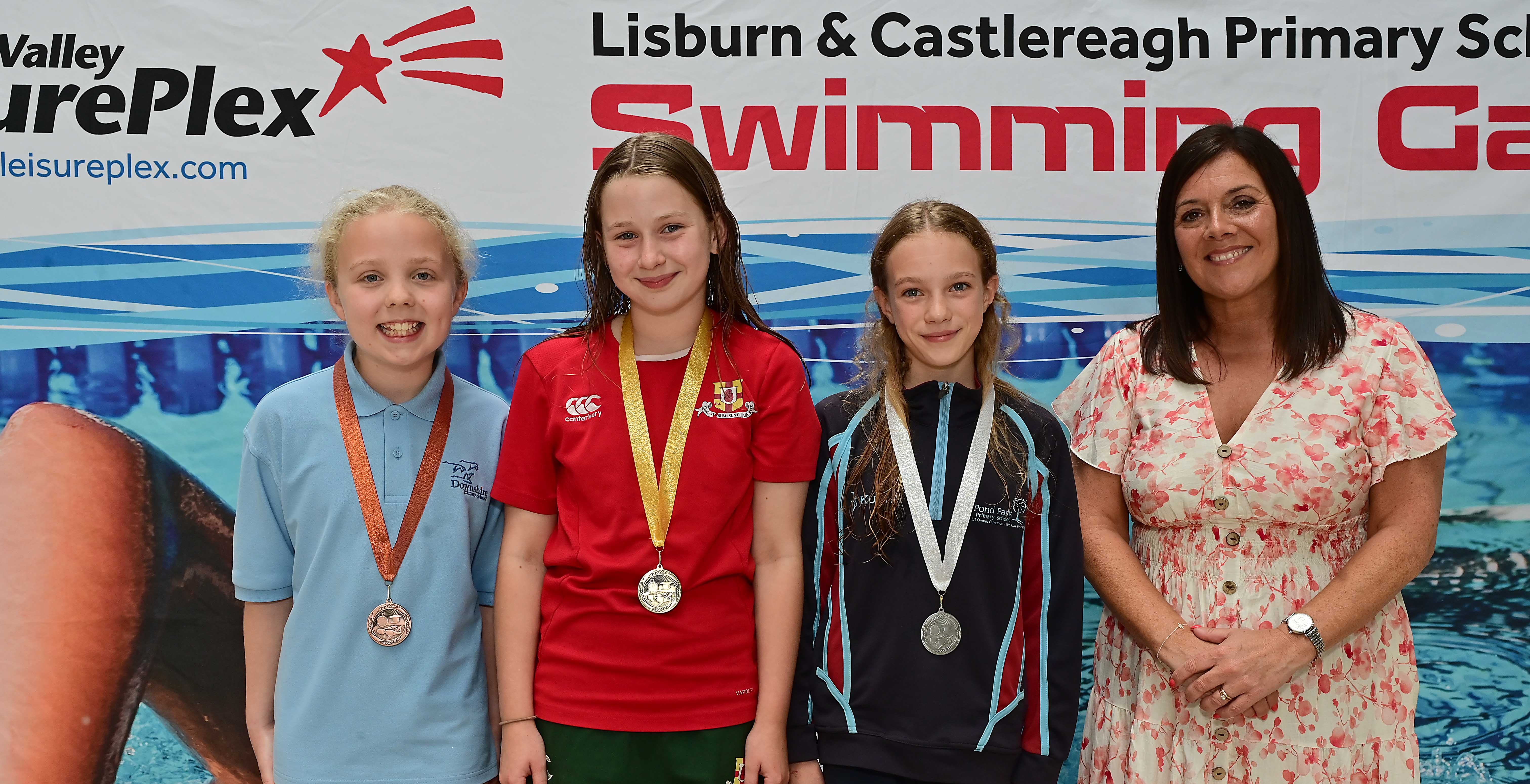 Chair of Communities and Wellbeing Committee, Councillor Sharon Lowry presents Event 23 Breaststroke (Club): 1st Mariella Harris (Friends’ Prep), 2nd Suzi Rayes (Pond Park) and 3rd Emily Erskine (Downshire) 