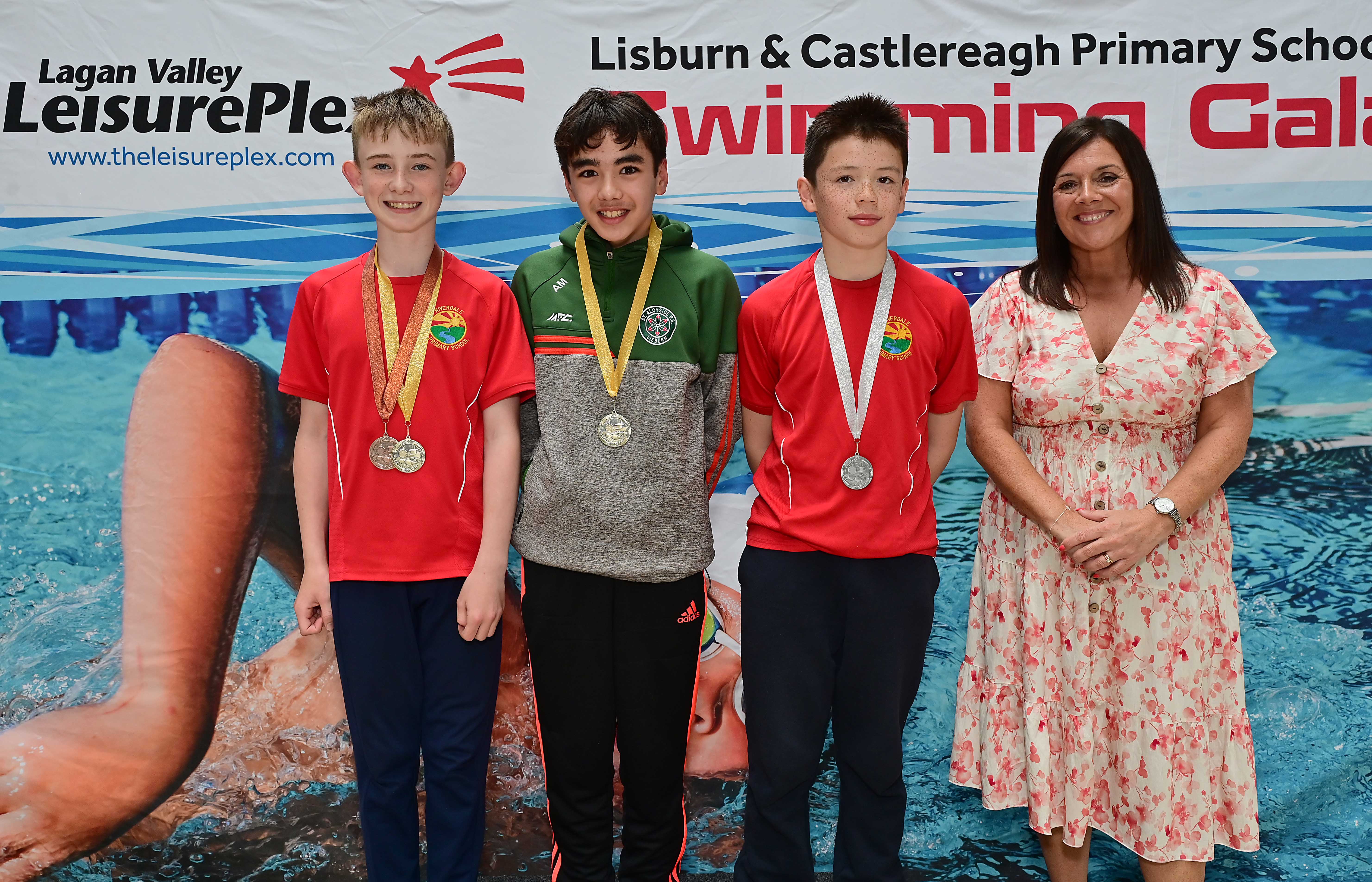 Chair of Communities and Wellbeing Committee, Councillor Sharon Lowry presents Event 26 Freestyle (Club): 1st Aaron Marr (St Aloysius), 2nd Zander Arbuthnott (Riverdale) and 3rd Sam Gray (Riverdale) 