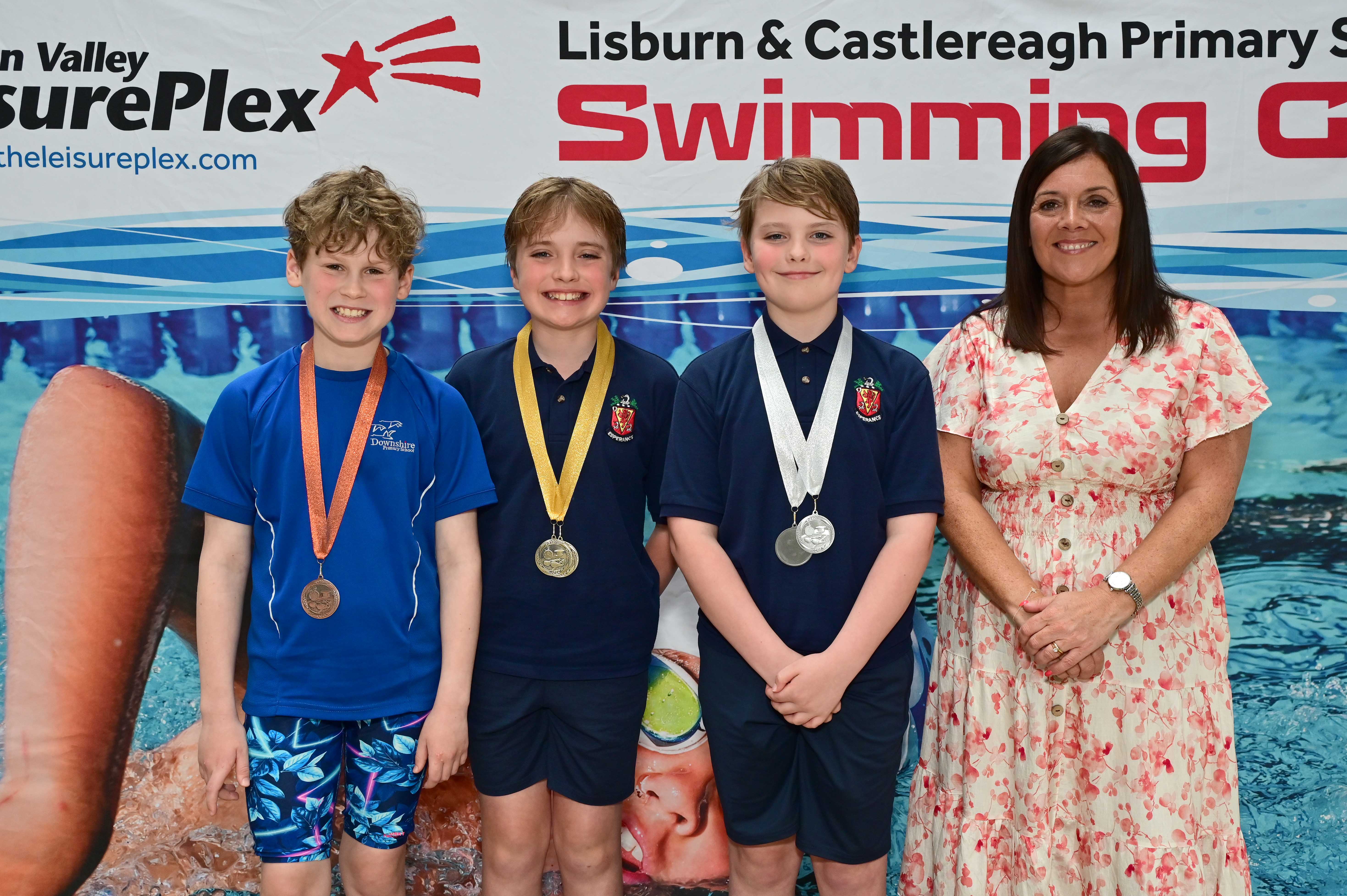 Chair of Communities and Wellbeing Committee, Councillor Sharon Lowry presents Event 28 Butterfly (Club): 1st Teddy Burke (Wallace Prep),    2nd Elliott Burke (Wallace Prep) and 3rd Carter Paul (Downshire)  