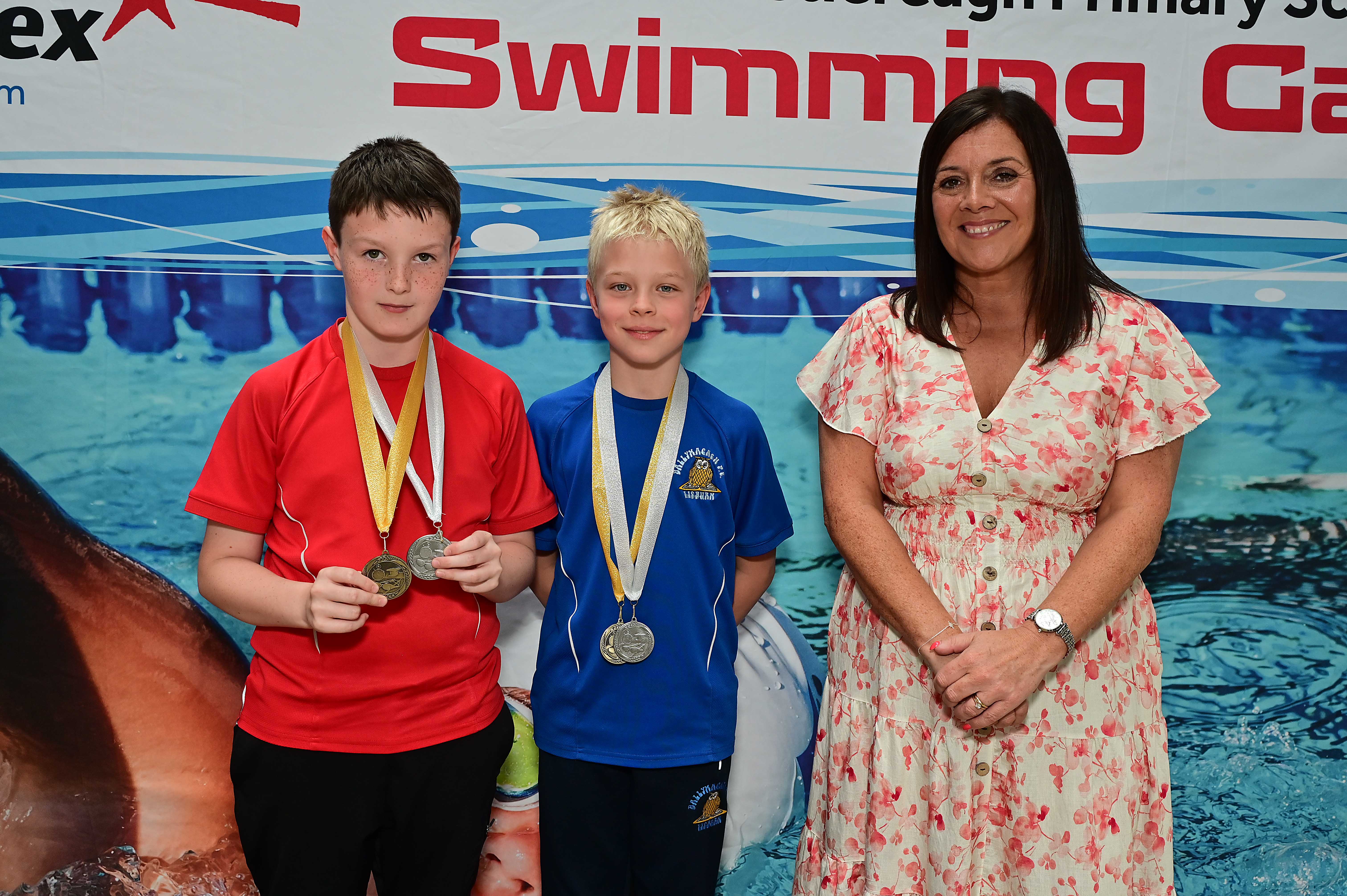 Chair of Communities and Wellbeing Committee, Councillor Sharon Lowry presents Event 28 Butterfly (Non-club): 1st Brody Simpson (St Aloysius), 2nd Timmy Jakubianec (Ballymacash) and 3rd  Shane Burke (St Aloysius)  