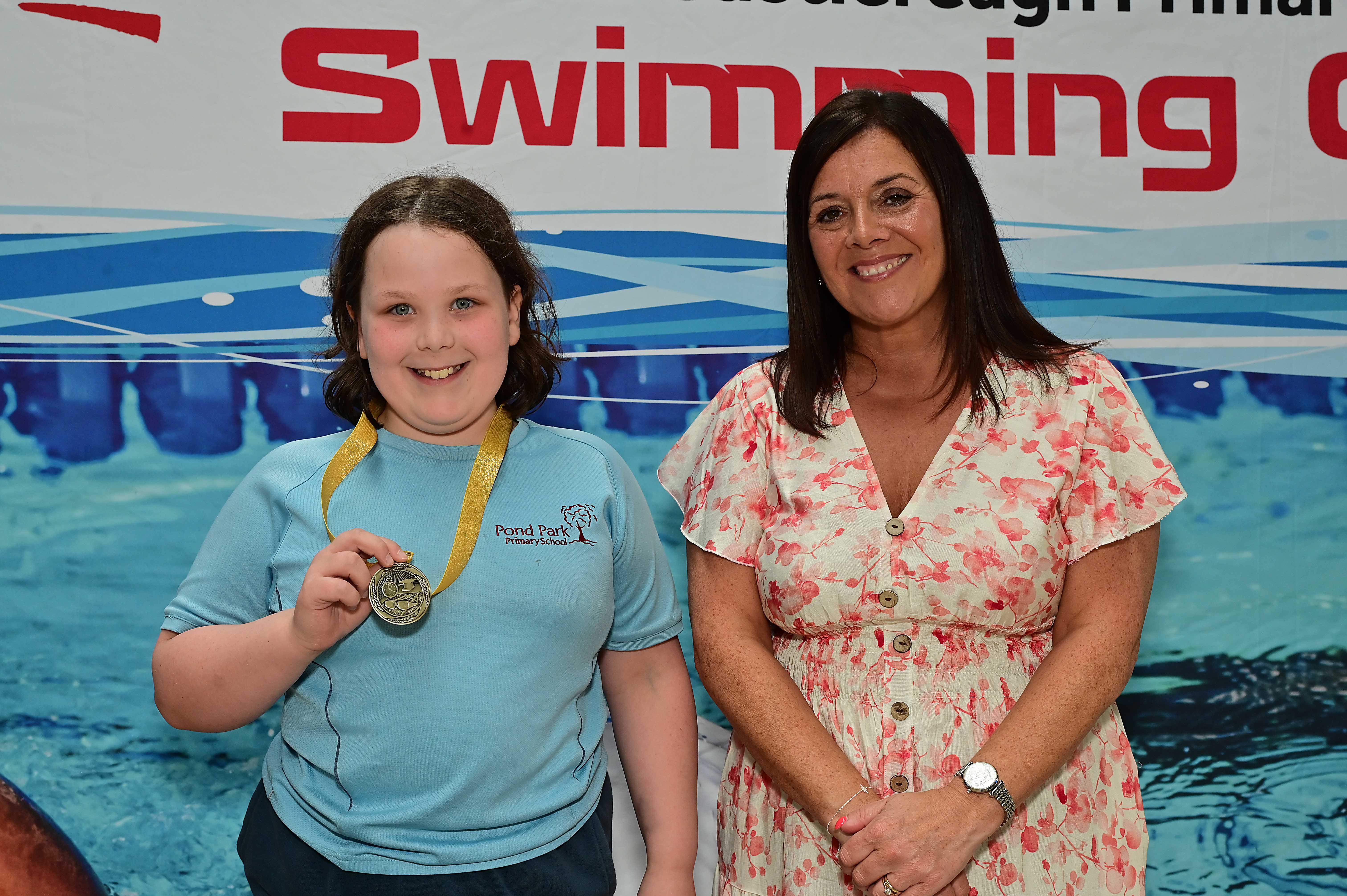Chair of Communities and Wellbeing Committee, Councillor Sharon Lowry presents Event 29 Butterfly (Non-club): 1st Lily-Rose Cassidy- Taylor 