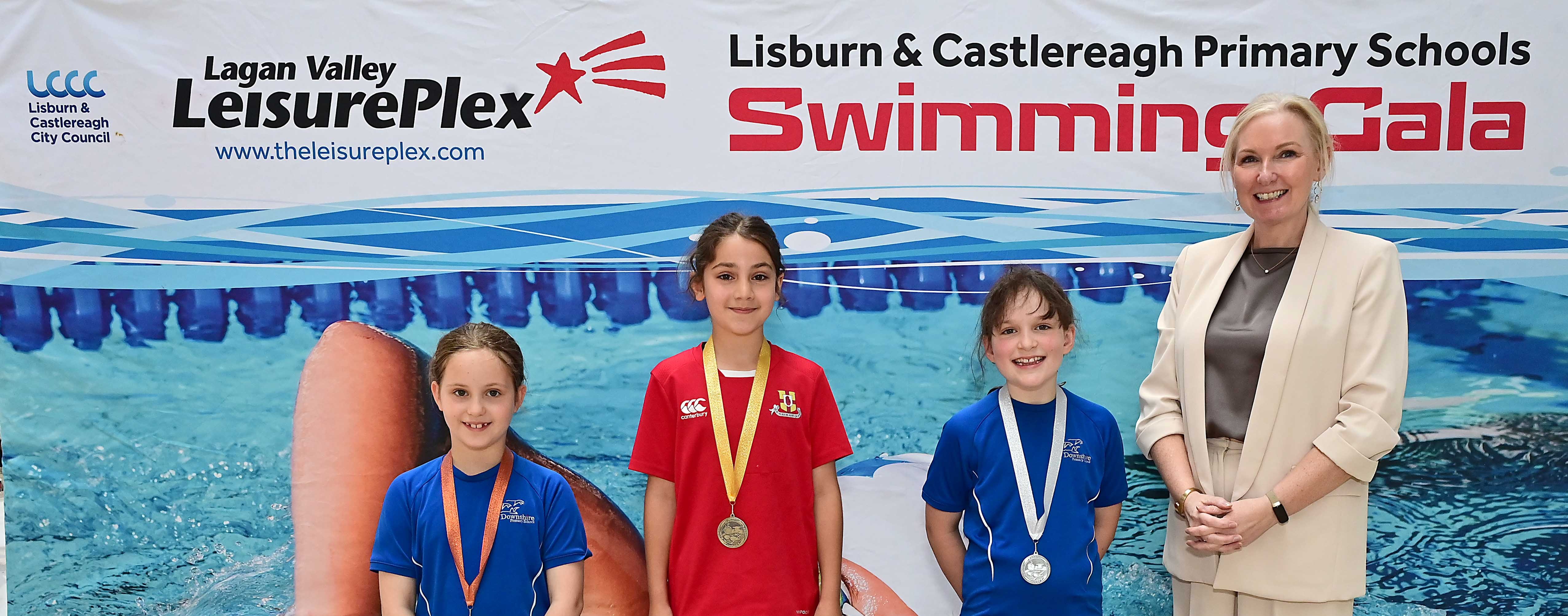 Louise Moore, Director of Leisure & Community Wellbeing presents Event 2 Backstroke (non-club) winners: 1st Georgie Kharouf (Friends’ Prep), 2nd Beatriz Taylor (Downshire) and 3rd Molly Steele (Downshire). 