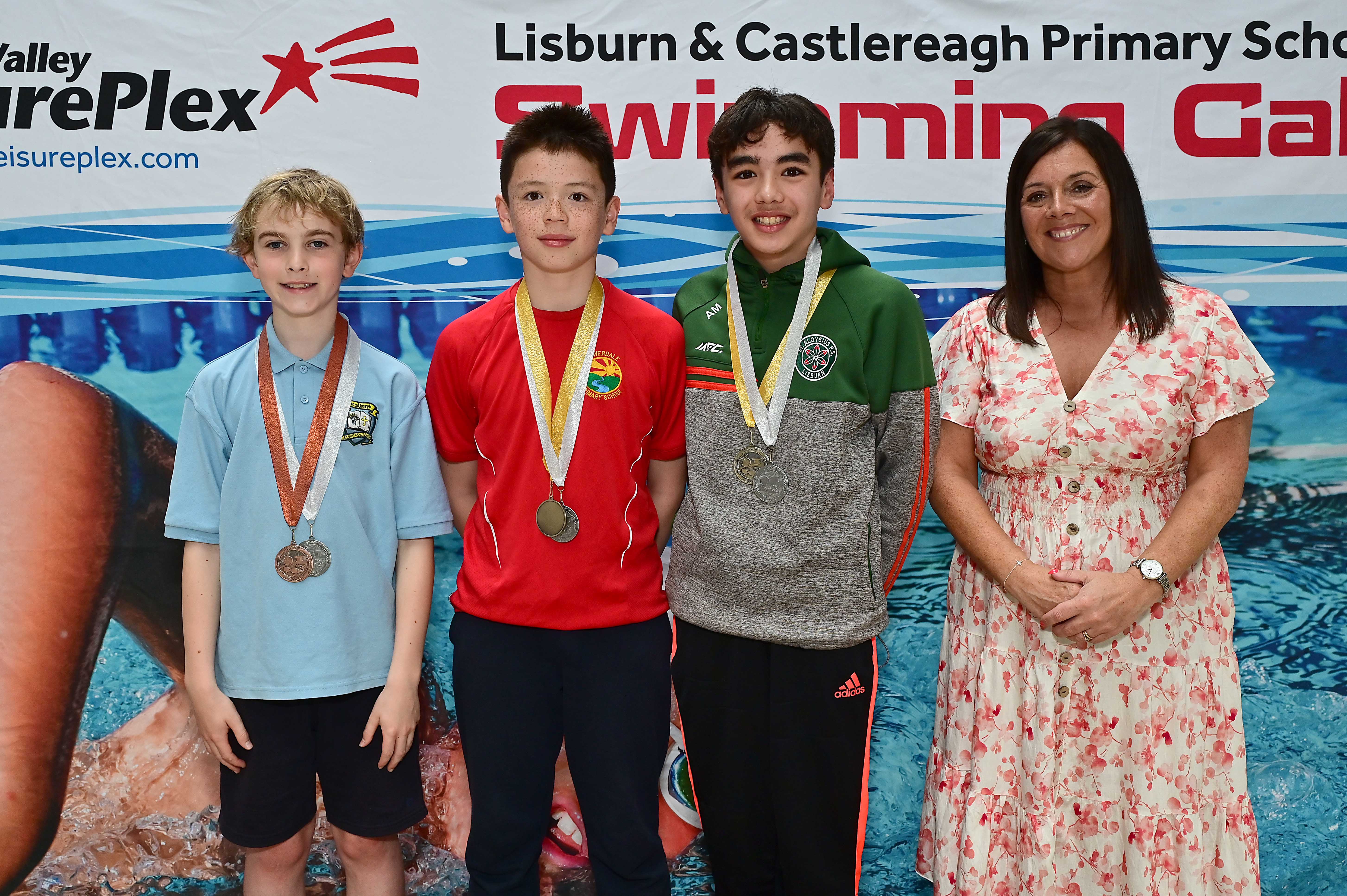 Chair of Communities and Wellbeing Committee, Councillor Sharon Lowry presents Event 30 Butterfly (Club):  1st Zander Arbuthnot (Riverdale),    2nd Aaron Marr (St Aloysius) and 3rd Cillian O’Neill (St Joseph’s) 
