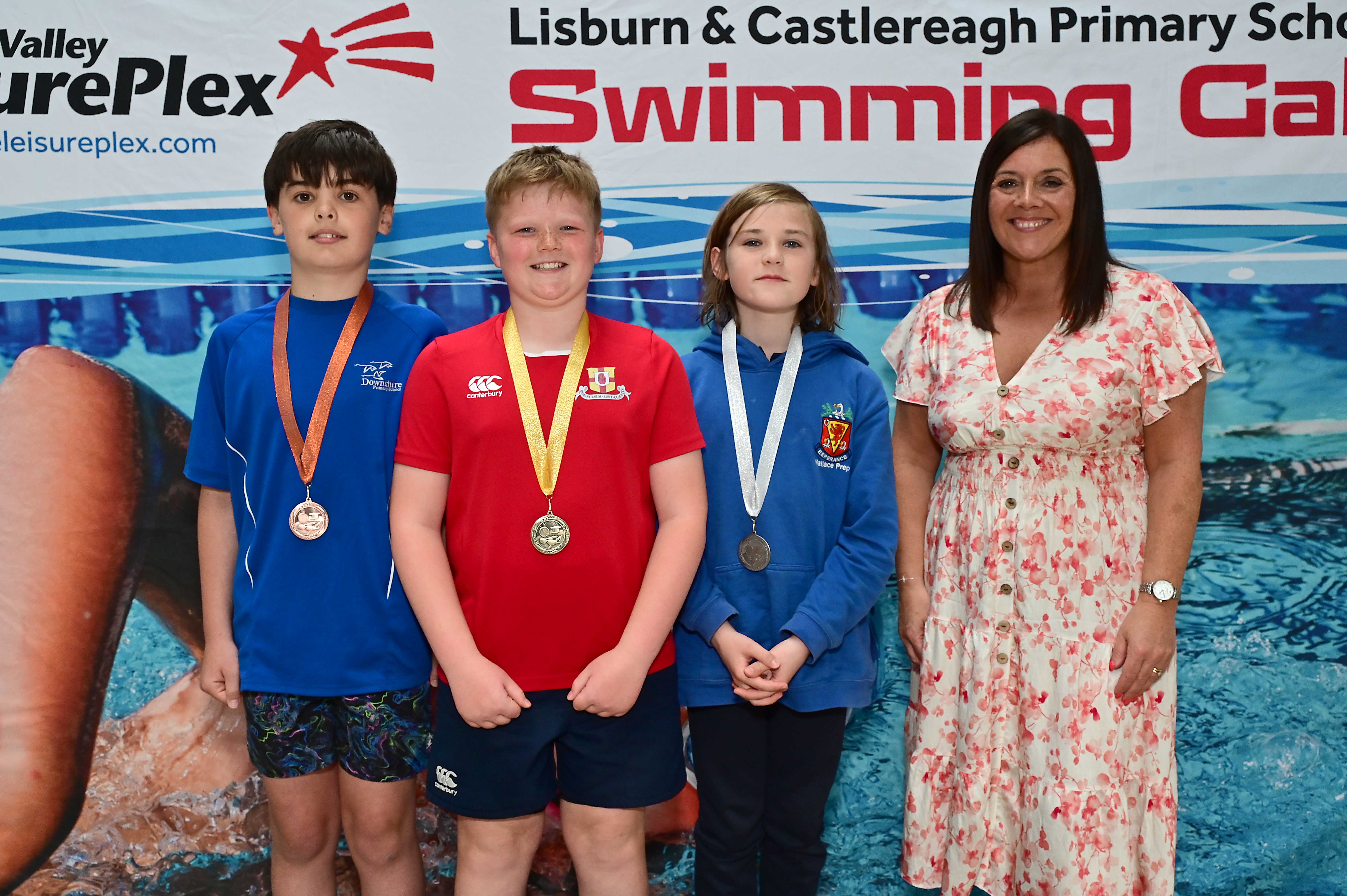 Chair of Communities and Wellbeing Committee, Councillor Sharon Lowry presents Event 30 Butterfly (Non-club): 1st Cameron Lunn (Friends’ Prep), 2nd Logan Elwood (Wallace Prep) and 3rd Luka Wilson (Downshire)  