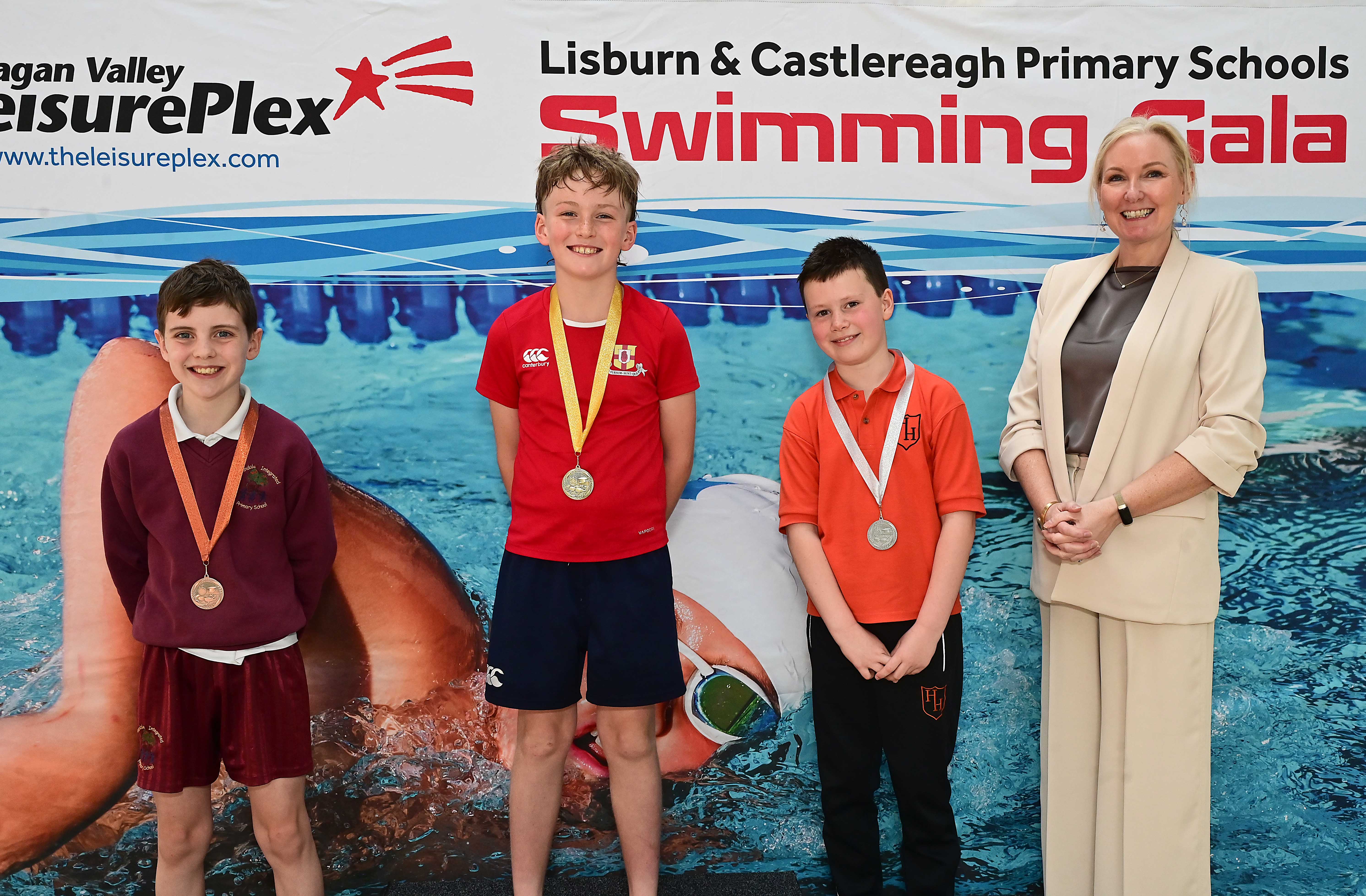 Louise Moore, Director of Leisure & Community Wellbeing presents Event 3 Backstroke (Club swimmers): 1st Finn McKeown (Friends’ Prep), 2nd Theo Frizelle (Harmony Hill) and 3rd Jonah McTaggart (Rowandale)