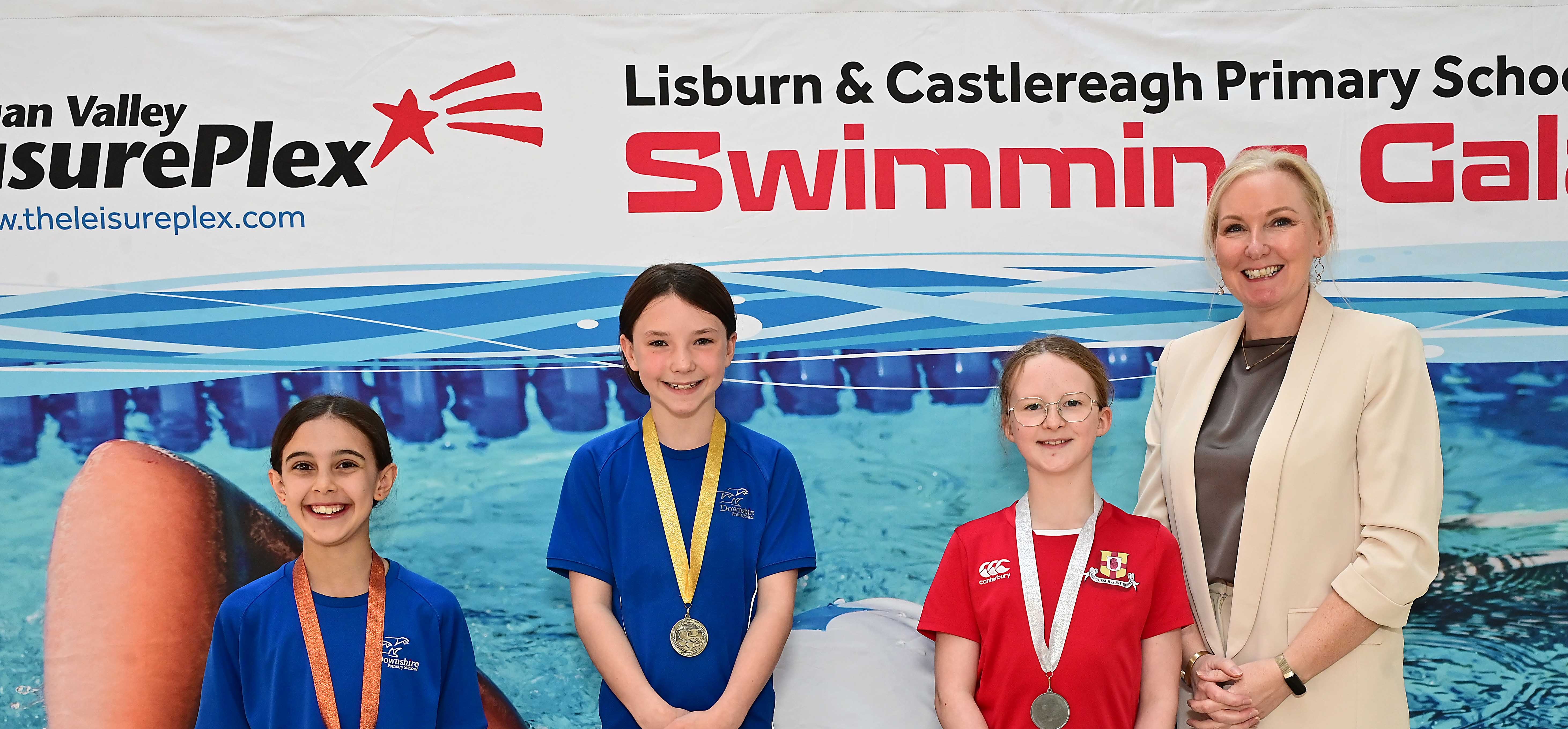 Louise Moore, Director of Leisure & Community Wellbeing presents Event 4 Backstroke (Club swimmers), 1st Ivy Carson (Downshire), 2nd Freya Snoddy (Friends’ Prep) and 3rd Madeline Cubitt (Downshire)