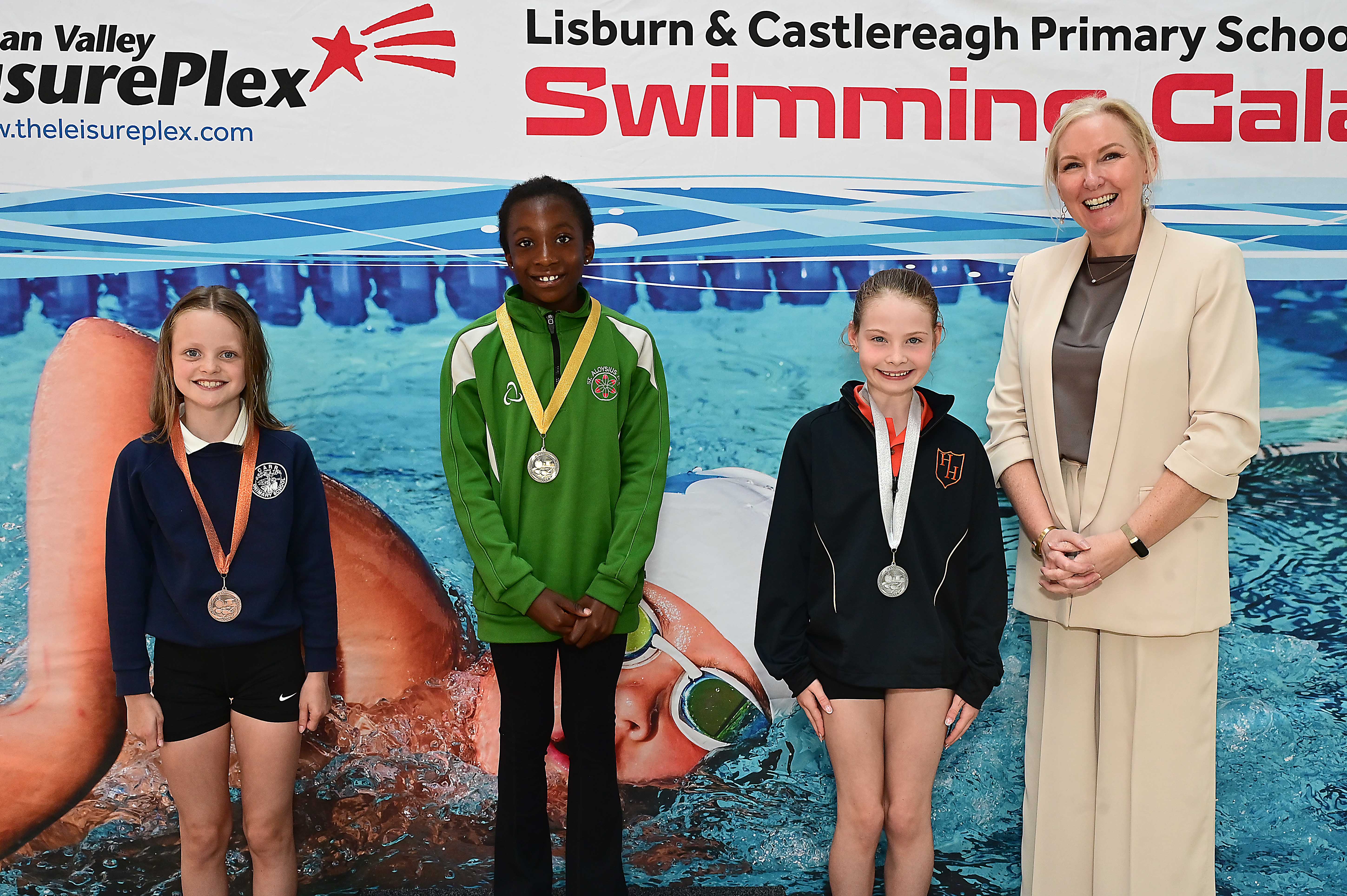Louise Moore, Director of Leisure & Community Wellbeing presents Event 4 Backstroke (non club) 1st Faith Abladey (St Aloysius), 2nd Arabella McCreery (Harmony Hill) and 3rd Anna Glenn (Carr)