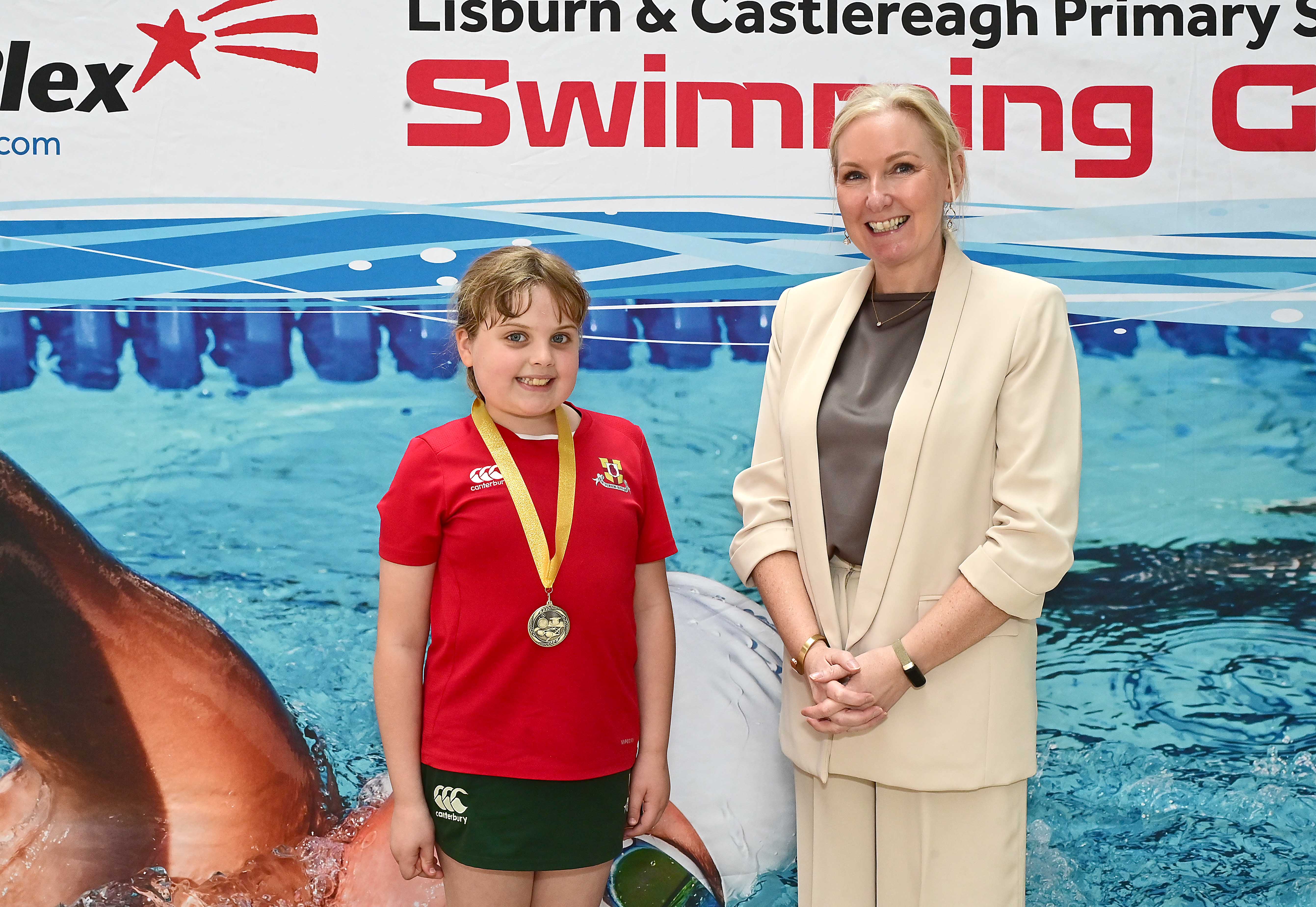 Louise Moore, Director of Leisure & Community Wellbeing presents Event 6 Breaststroke to Club winner, Ava McIlveen (Friends’ Prep)