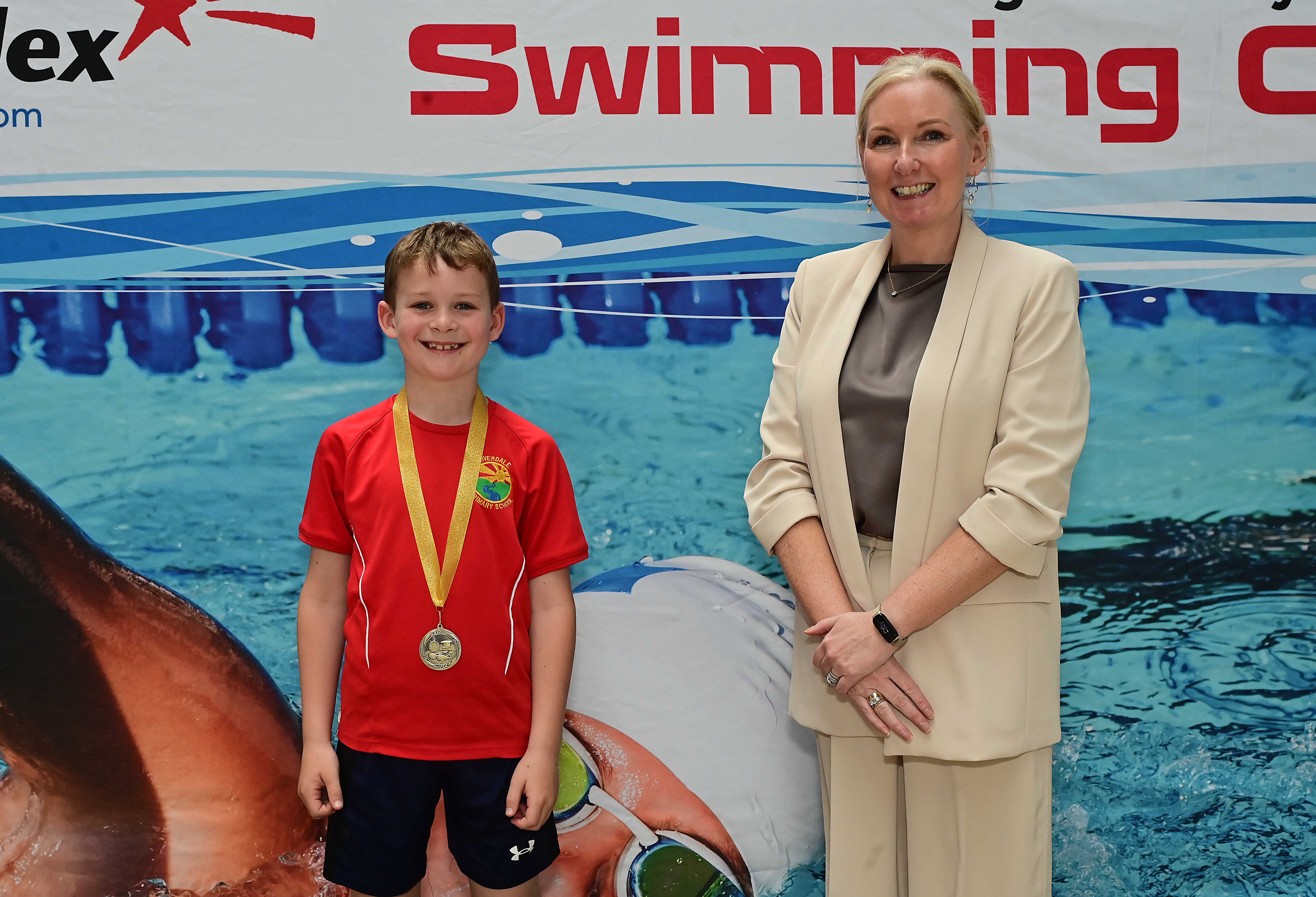 Louise Moore, Director of Leisure & Community Wellbeing presents Event 9 Freestyle to Club Winner in 1st place Daneil Kennedy (Riverdale) 