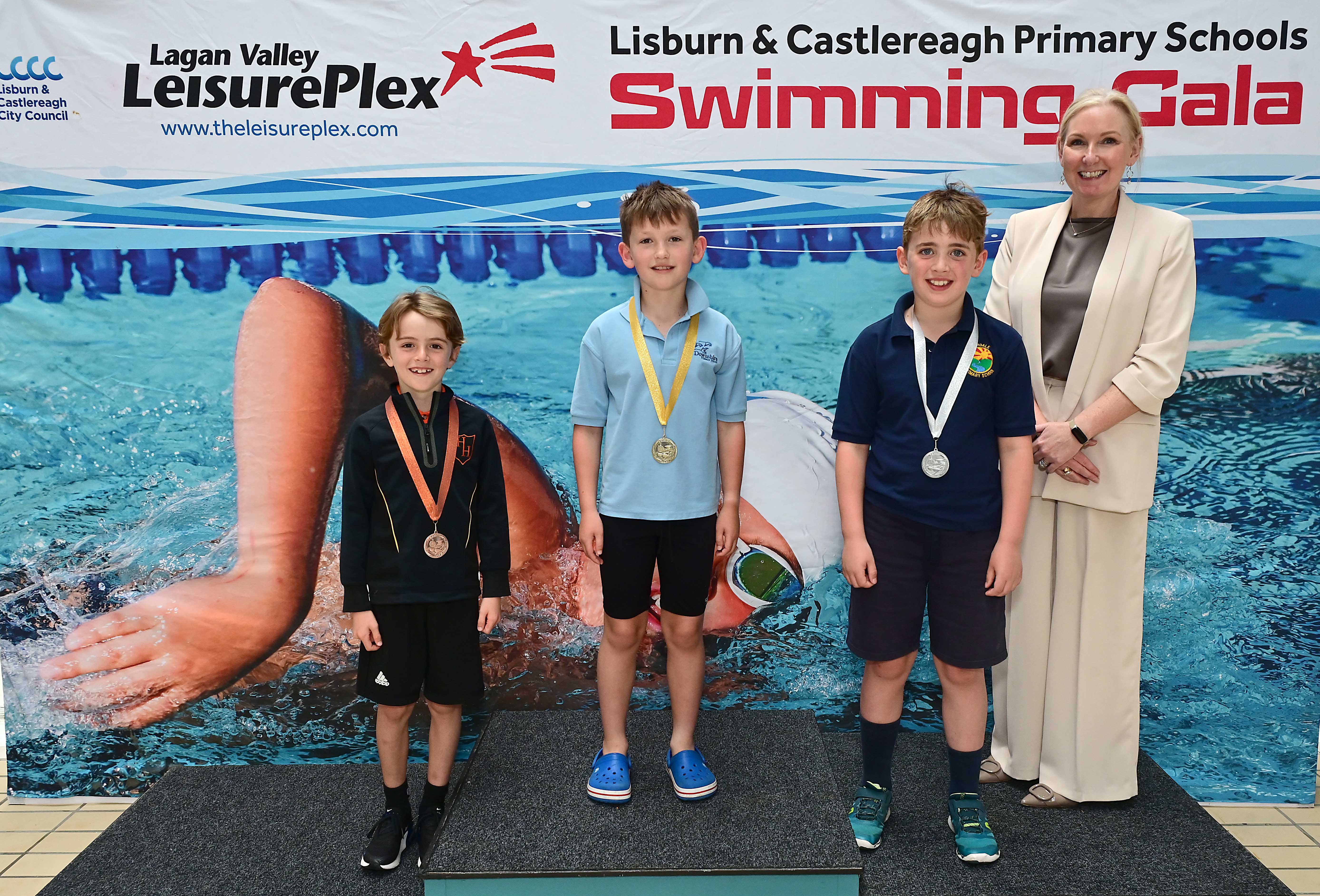 Louise Moore, Director of Leisure & Community Wellbeing presents Event 9 Freestyle (non-club) 1st Zachery Summers (Downshire), 2nd Oscar Cronin (Riverdale) and 3rd Ethan Neeson (Harmony Hill