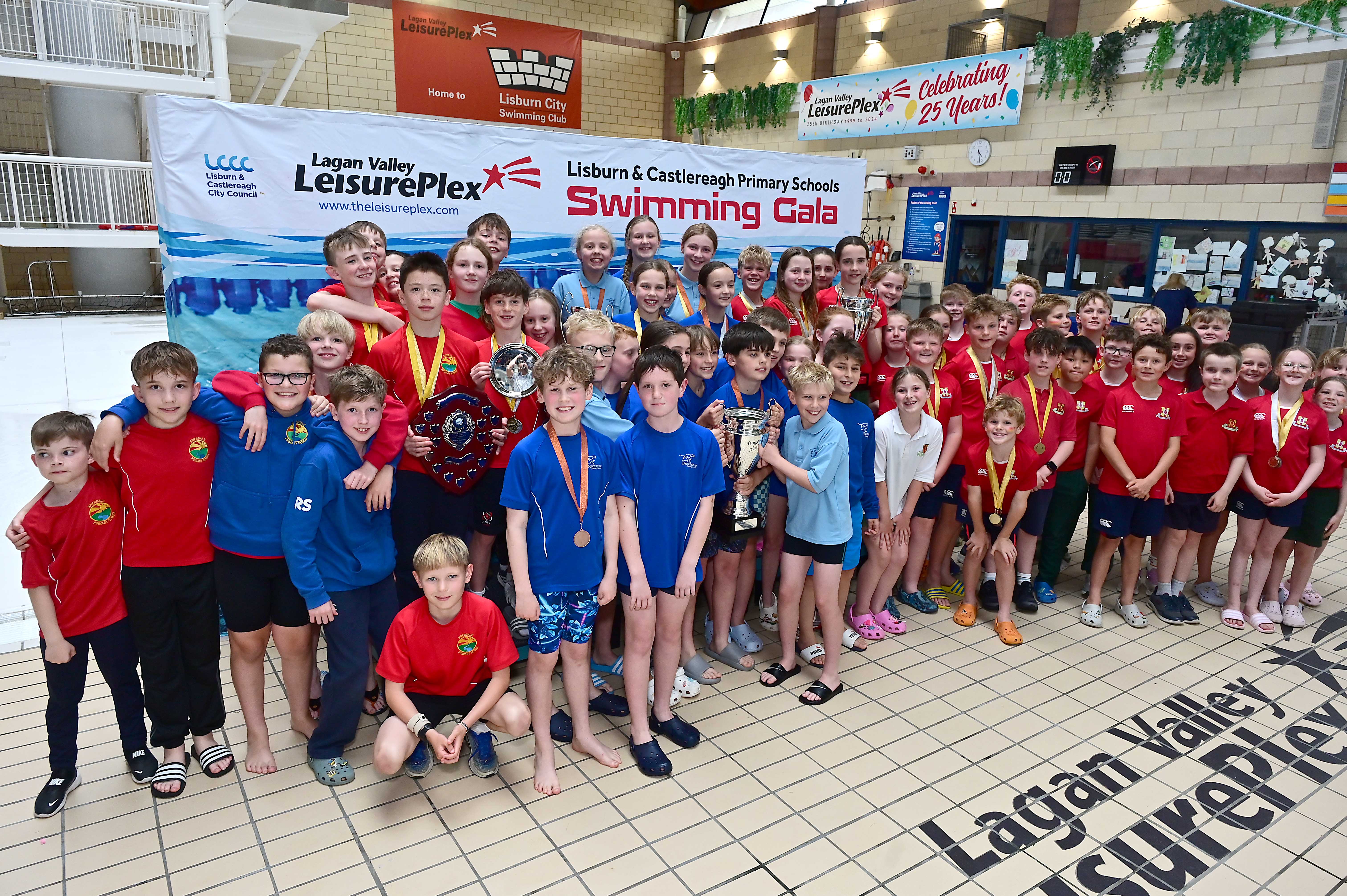 Chair of Communities and Wellbeing Committee, Councillor Sharon Lowry presents the Overall Schools Event to Downshire Primary School in first place followed by Friends’ Prep in second place, with Riverdale Primary School claiming third. 