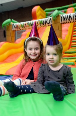 Two children with party hats