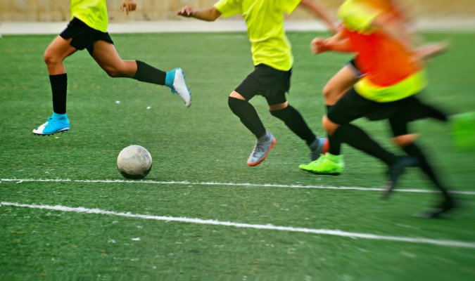 Kids playing football